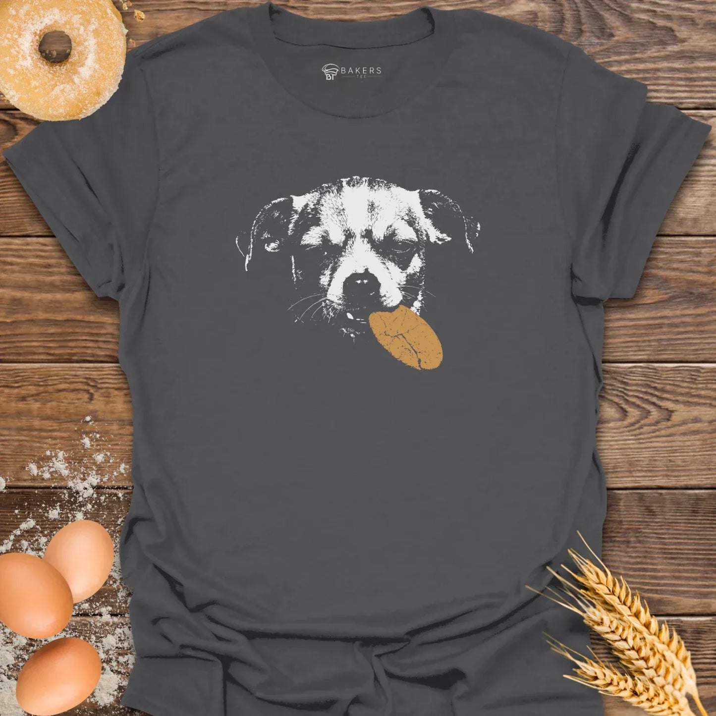 Charcoal t-shirt featuring a white graphic of a dog holding a brown cookie in its mouth.