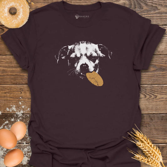 Chocolate t-shirt featuring a white graphic of a dog holding a brown cookie in its mouth.