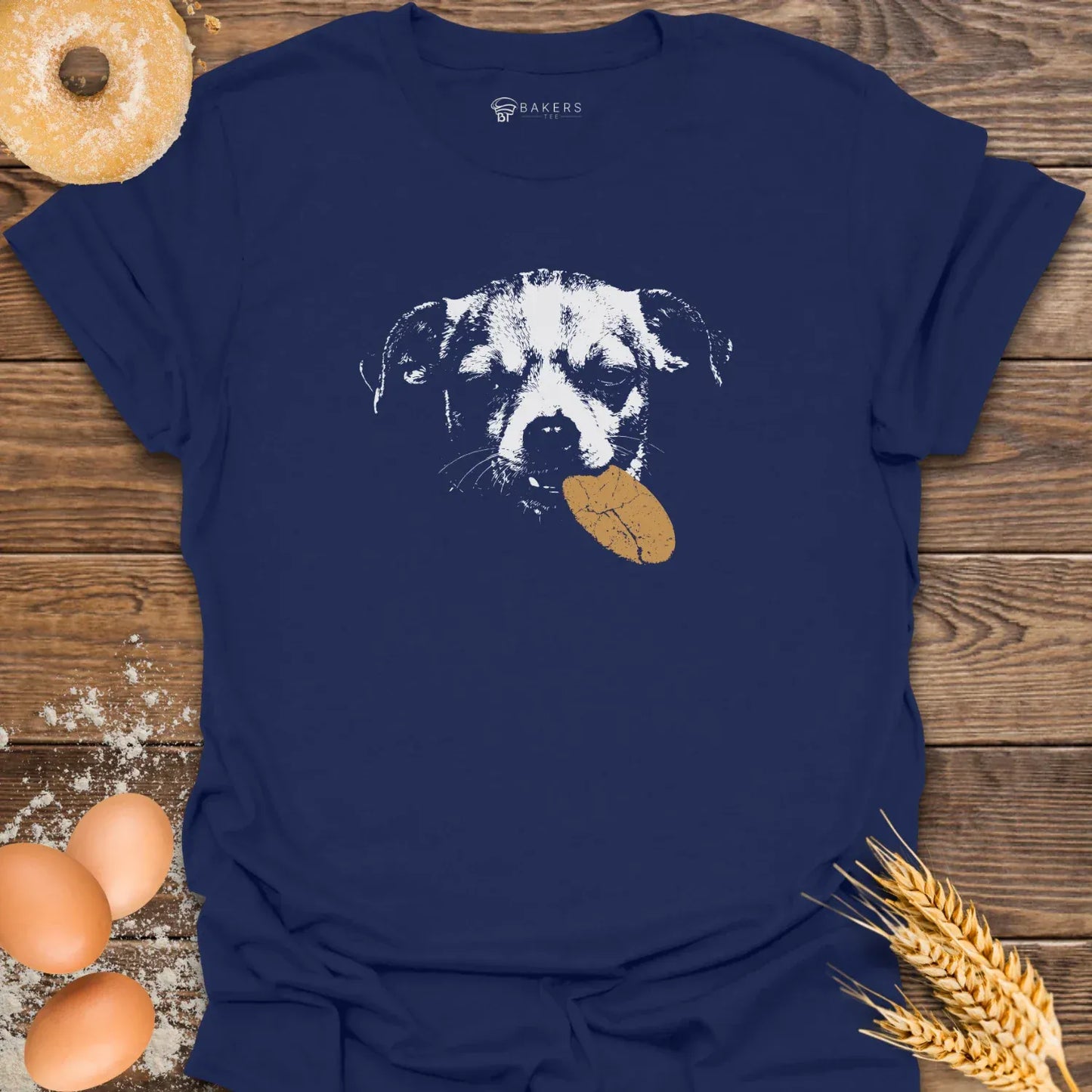 Navy t-shirt featuring a white graphic of a dog holding a brown cookie in its mouth.